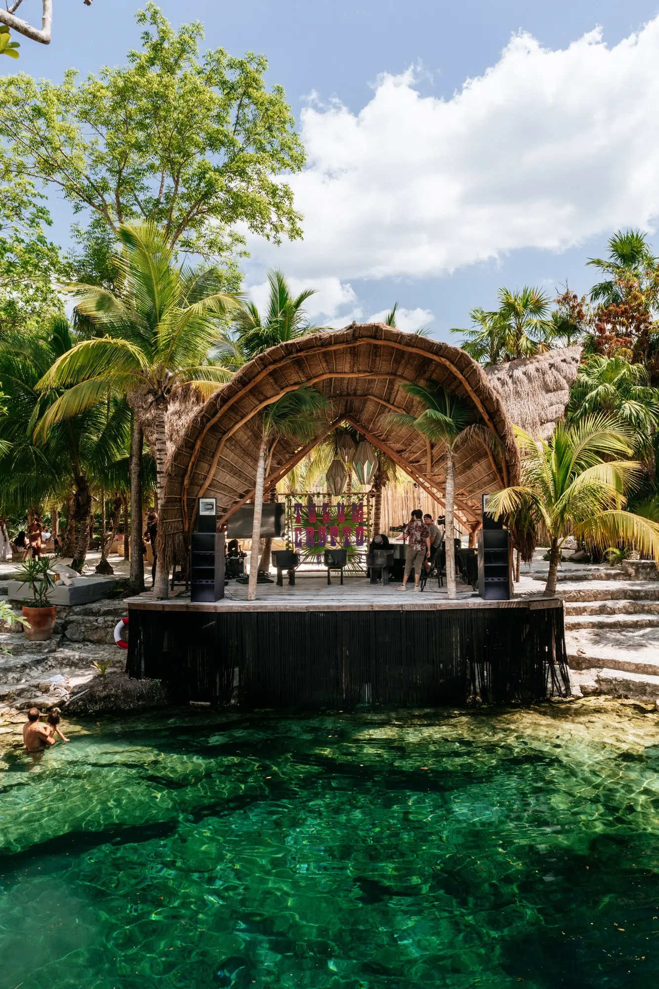 Open-air festival stage beside a cenote during a previous edition
