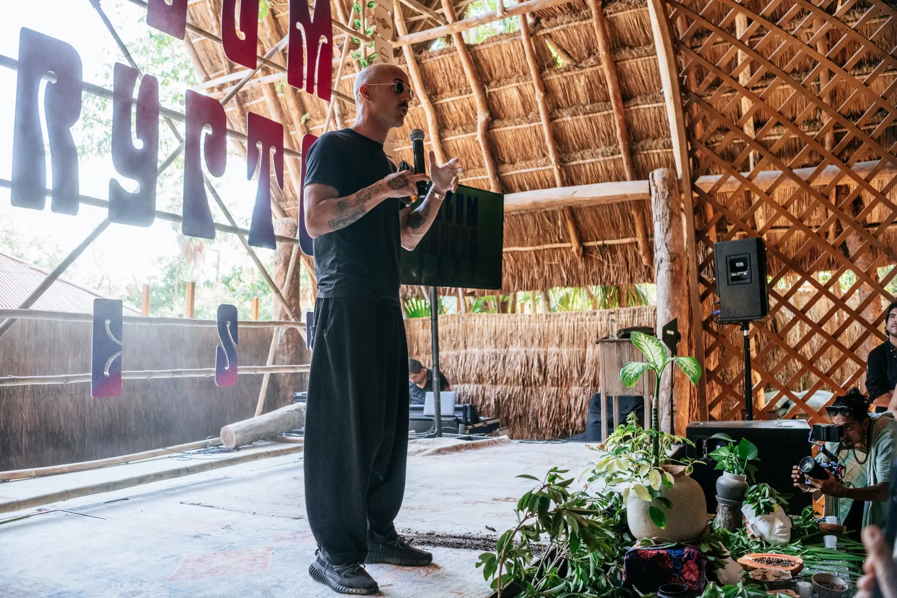 Founder presenting on an open-air stage during a previous festival edition