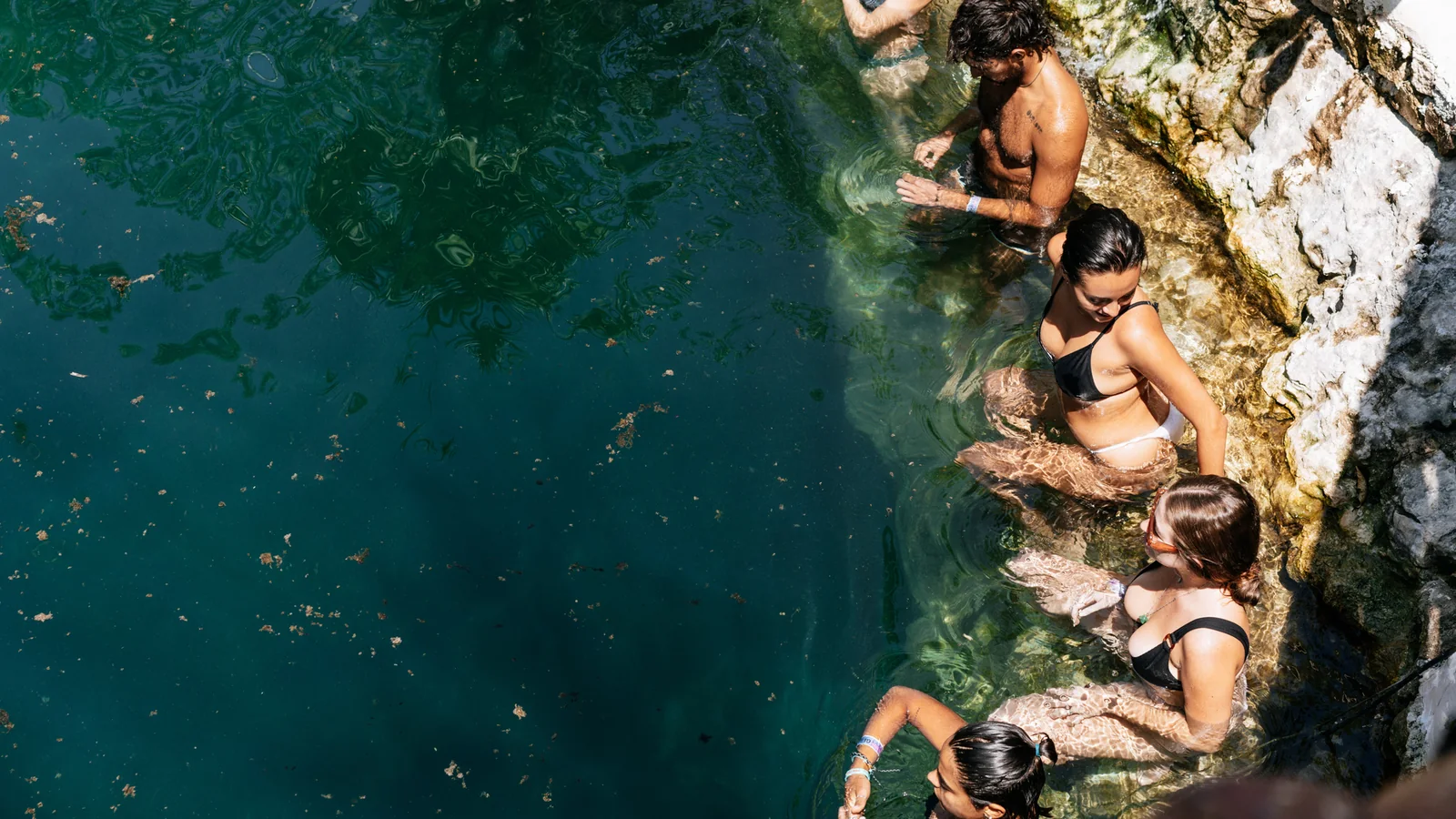 Attendees relaxing in the cenote during a previous TIF edition