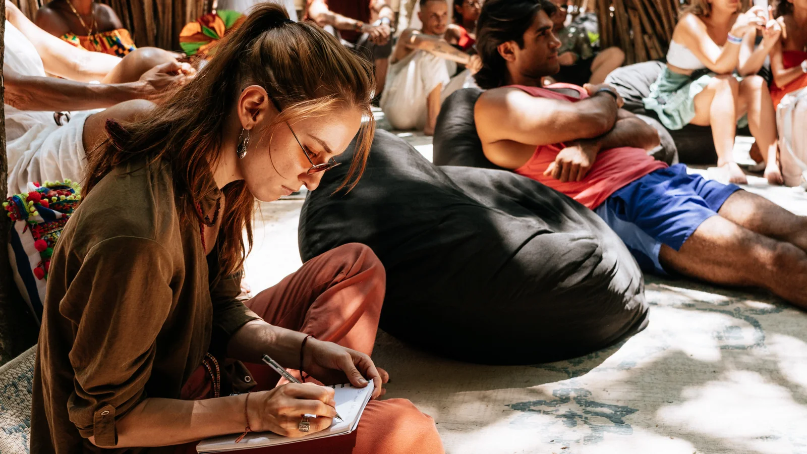 Attendee taking notes during a workshop at a previous TIF edition
